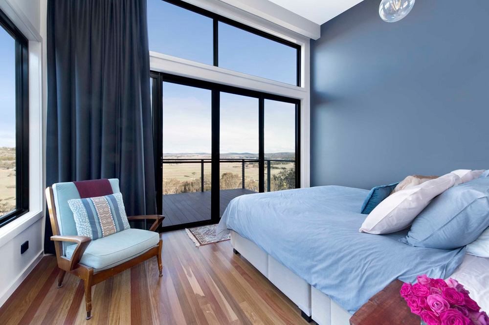 Bedroom with deck in contemporary Australian architectural style