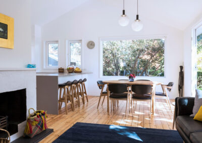 Renovated open-plan living area with views to garden. Designed by Architecture Republic, Canberra