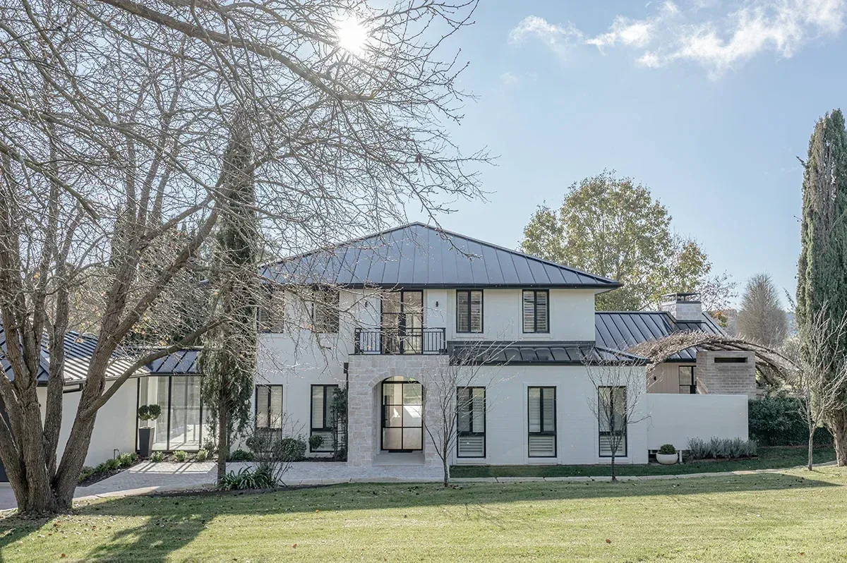 Architectural courtyard with Bowral trees and a glass pavillion